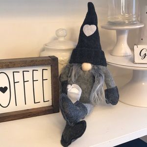 Gnome holding coffee cup